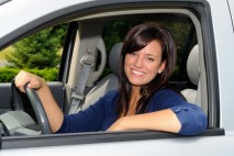 Beautiful Young Mother At The Wheel Of Her Sport Utility Vehicle